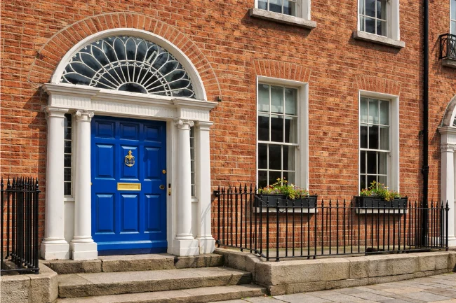 Classic red-brick townhouse doorway with fanlight showing Georgian architecture in Dublin
